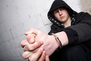 Teenager in handcuffs